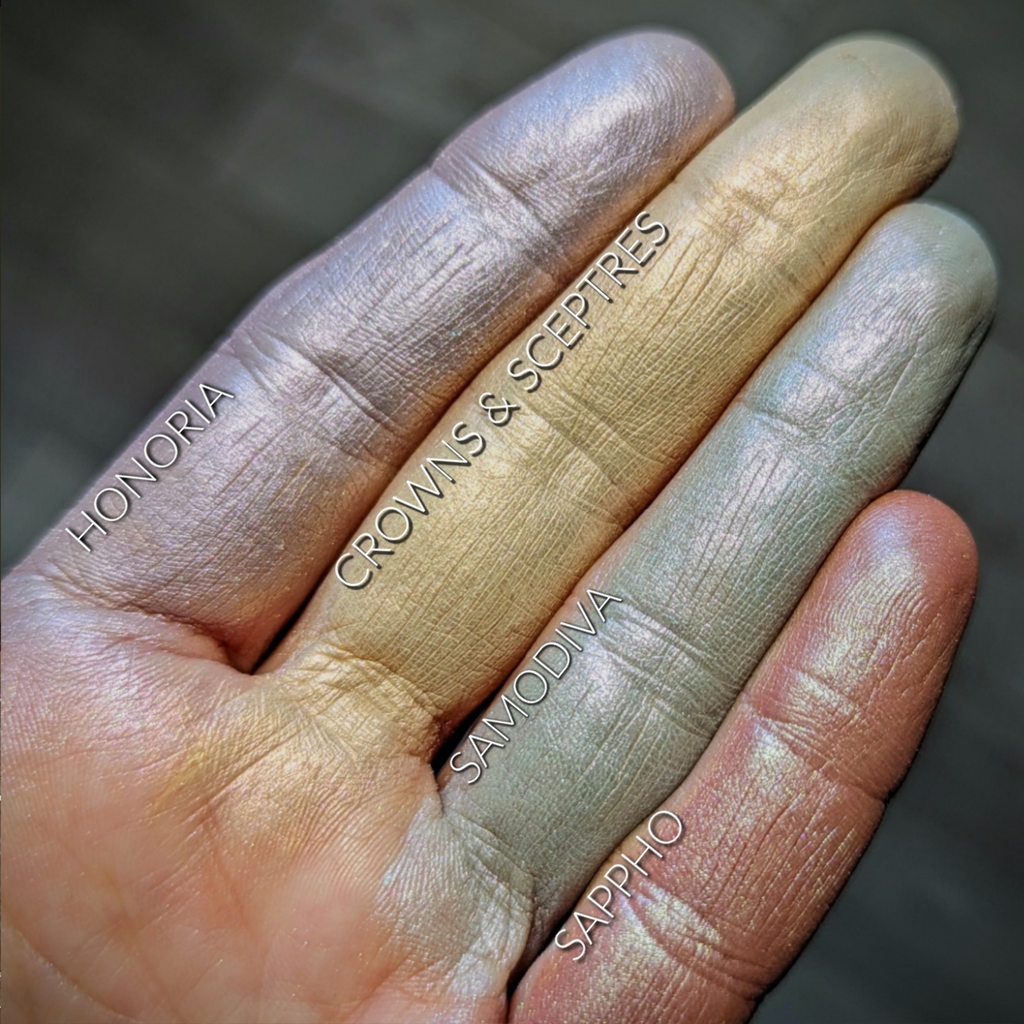 HONORIA eyeshadow loose and swatched on the skin. Honoria is a lilac with grey tones and beautiful multi-tonal copper/pink highlights.