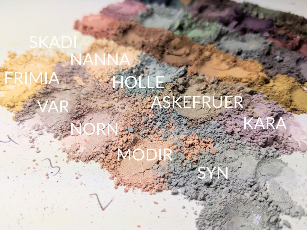 Piles of loose powder matte eyeshadow in pale shades. F