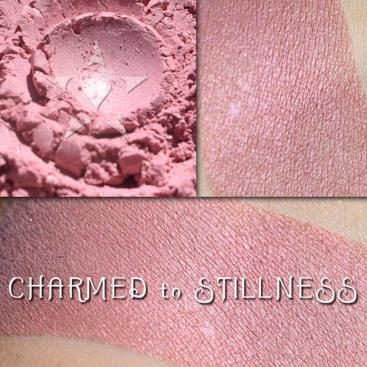 CHARMED TO STILLNESS - Rouge loose and swatched on the skin. Tea rose with soft copper undertones, slight shimmer finish