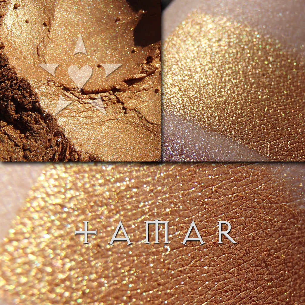 TAMAR eyeshadow loose and swatched on the skin. Tamar is a rich gold which shifts to a coppery autumn tone.