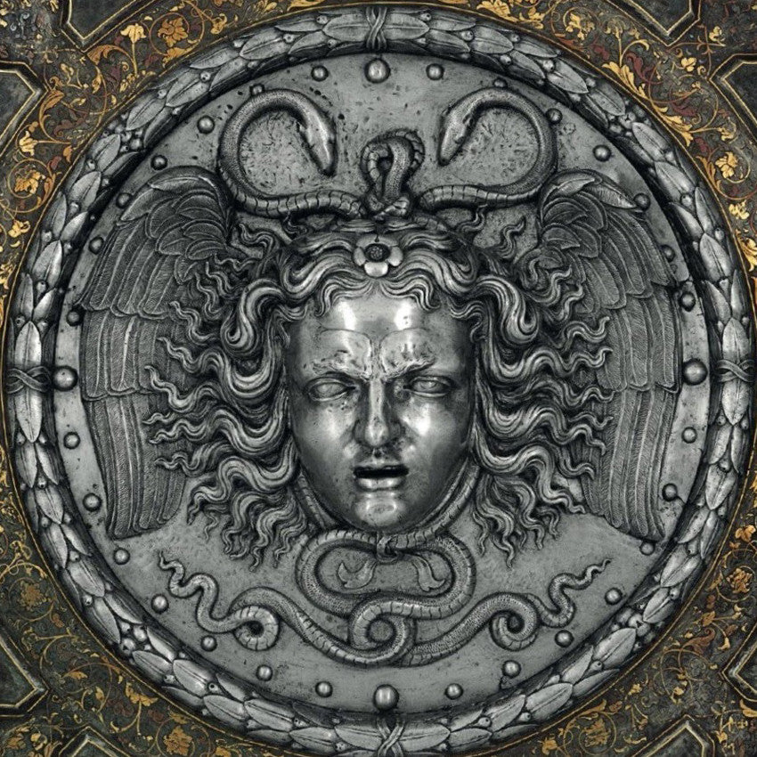 AMPHISBAENA product swatches, shown loose and on the skin. cool greyed mauve contour powder