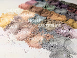 Piles of loose powder matte eyeshadow in pale shades. 