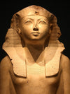 A stone bust of Hatshepsut with traditional Egyptan headdress
