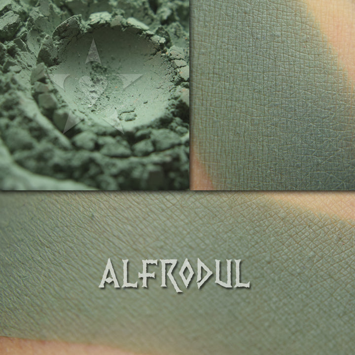 Image shows skin swatches of Alfrodul eyeshadow, Medium tone cool green, slightly muted.