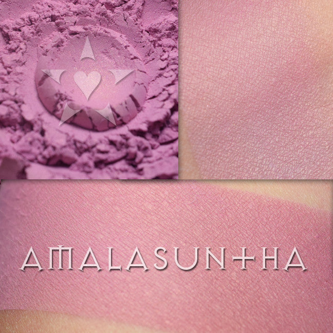 Image shows light and moderate skin swatches of Amalasuntha rouge, a mauved rose with copper shimmer