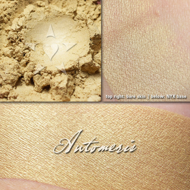 AUTOMERIS - Multipurpose highlighter/eyeshadow  loose and swatched on the skin. A pale buttery cream/gold.