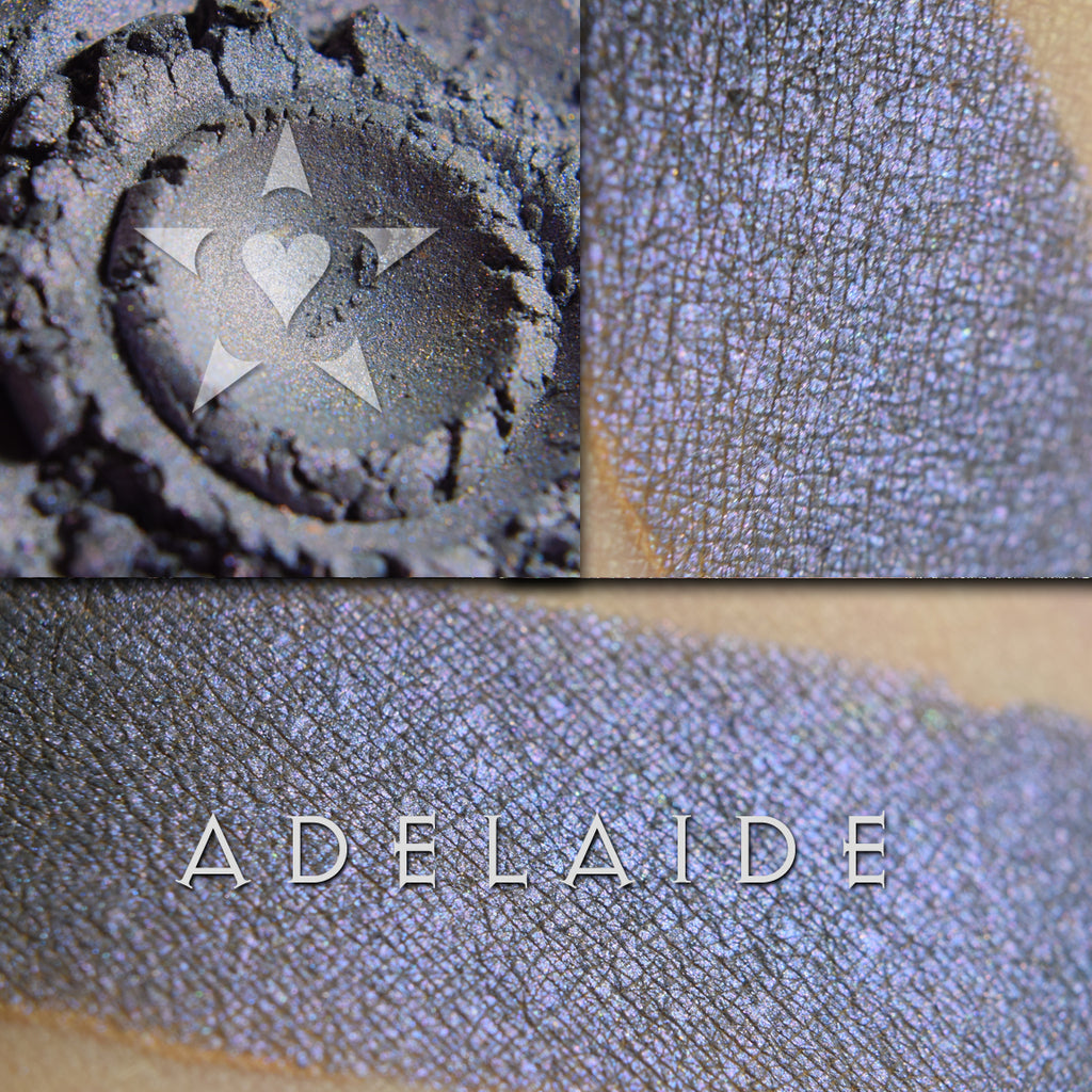 Image of swatches on skin of Adelaide eyeshadow. Adelaide is a rich violet-blue with multi-tonal overlays of rose and violet.