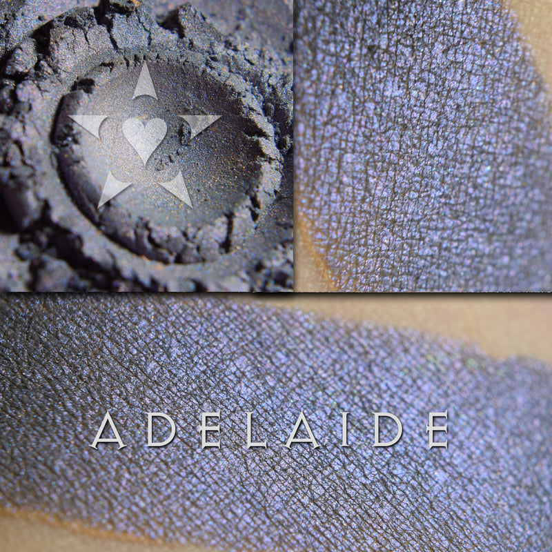 Image of swatches on skin of Adelaide eyeshadow. Adelaide is a rich violet-blue with multi-tonal overlays of rose and violet.