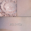 BELOVED - Finishing Powder loose and swatched on the skin. A delicate pink-toned finishing powder with slight luster.