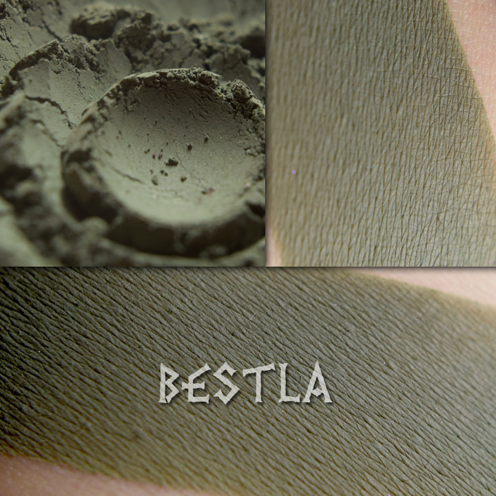 Bestla matte eyeshadow in a collage shown loose and swatched on the skin. Dark olive khaki. matte finish.