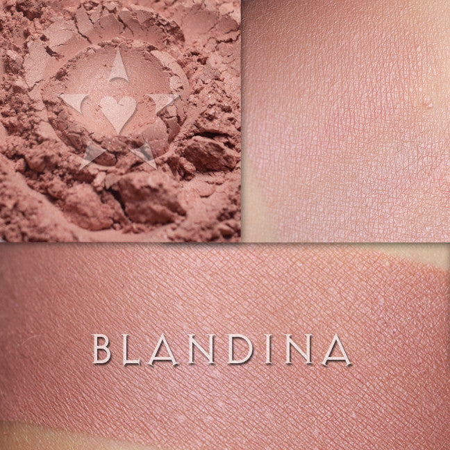 Blandina rouge shown loose and swatched on the skin. very wearable nude shade with pink tones