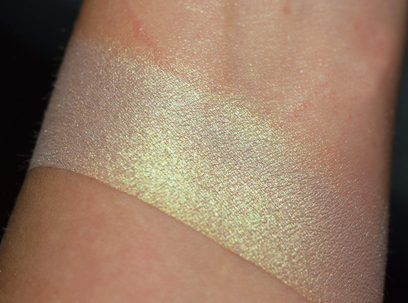 BRAHMA - EYESHADOW swatched on skin of inner arm. a delicate pastel pinkish brown with a strong grass green highlight. 