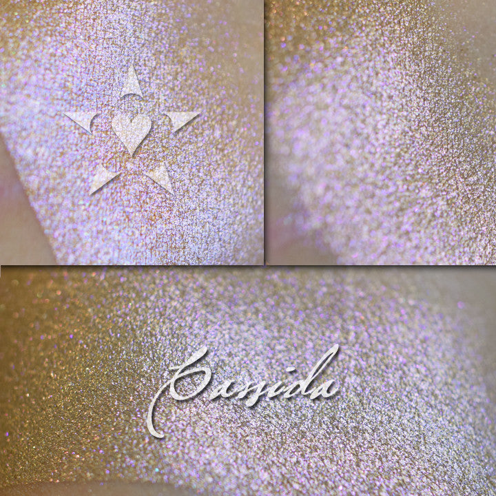 CASSIDA - Vintage Aromaleigh Eyeshadow loose and swatched three ways. A metallic bronze base with violet to magenta to reddish color travel. 