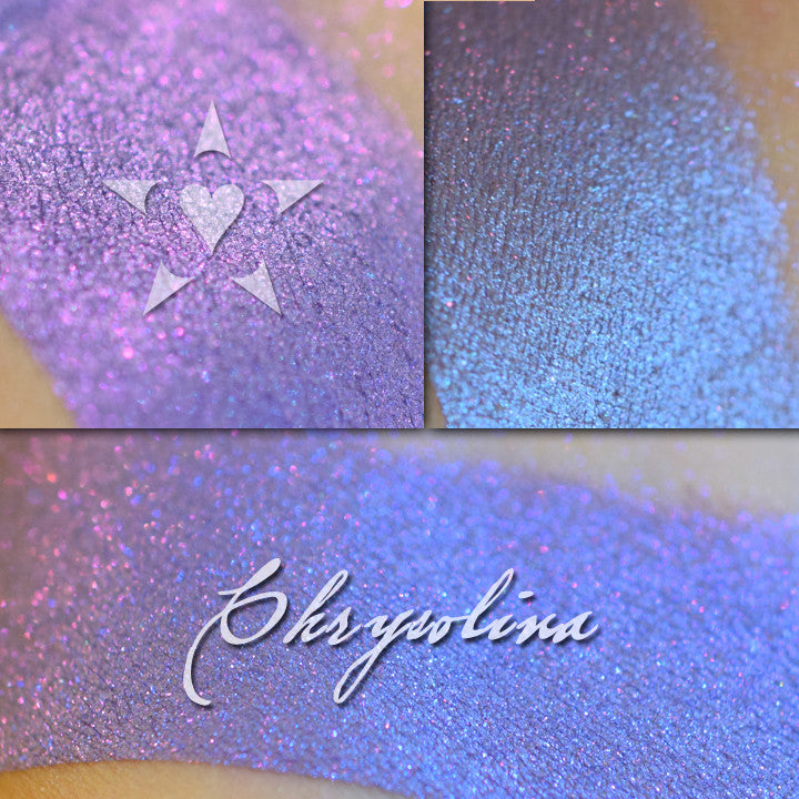 CHRYSOLINA - Vintage Aromaleigh Eyeshadow swatched on the skin in 3 views. A vibrant blue purple with a violet to blue shift depending on lighting conditions.