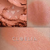 CLOELIA rouge shown loose and swatched on the skin. a wearable tangerine with a soft pinkish luster