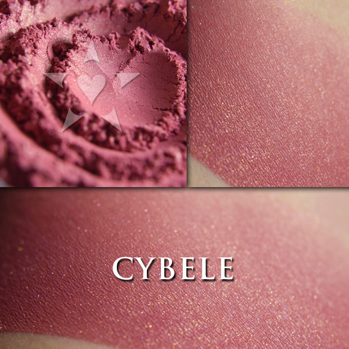 CYBELE rouge loose and swatched on the skin,. a gorgeous berry red with a strong gold/copper shift