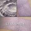 CERRIDWEN - HIGHLIGHTER  loose and swatched on the skin. Cerridwen is a unique shade with tones of silvery pink and mauve. 