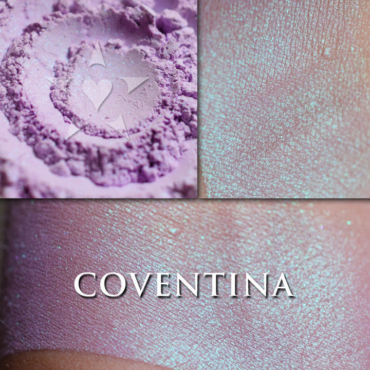 COVENTINA - highlighter loose and swatched on the skin. a warm purple with a very strong turquoise iridescence