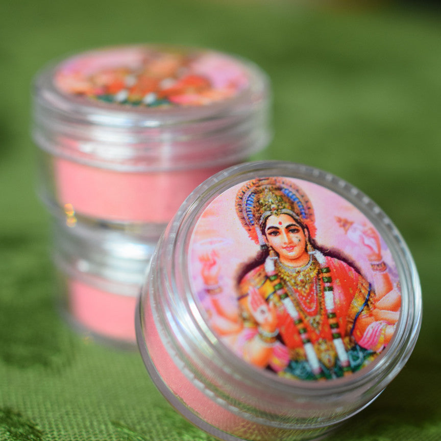 Jars of Shakti rouge with a label showing the Goddess in coral and pink robes.