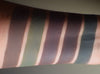 Skin swatches shown on inner arm of deep matte colors from this collection. Fjorgyn is second from right.