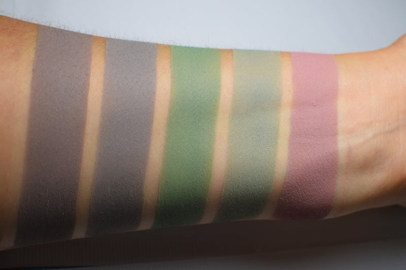 Matte eyeshadows swatched on medium tone caucasian skin. Laga is second from the right.,