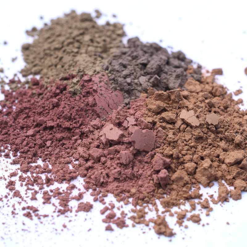 Image shows various loose piles of the five shades that are in the Insectarium multipurpose contour collection. They are a warm brown, warm deep peach, deep rosy brown, muted taupe and soft yellowish brown.
