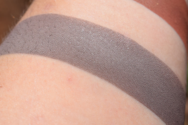 Deathly Pallor swatched on medium tone caucasian skin.  Cool greyed taupe