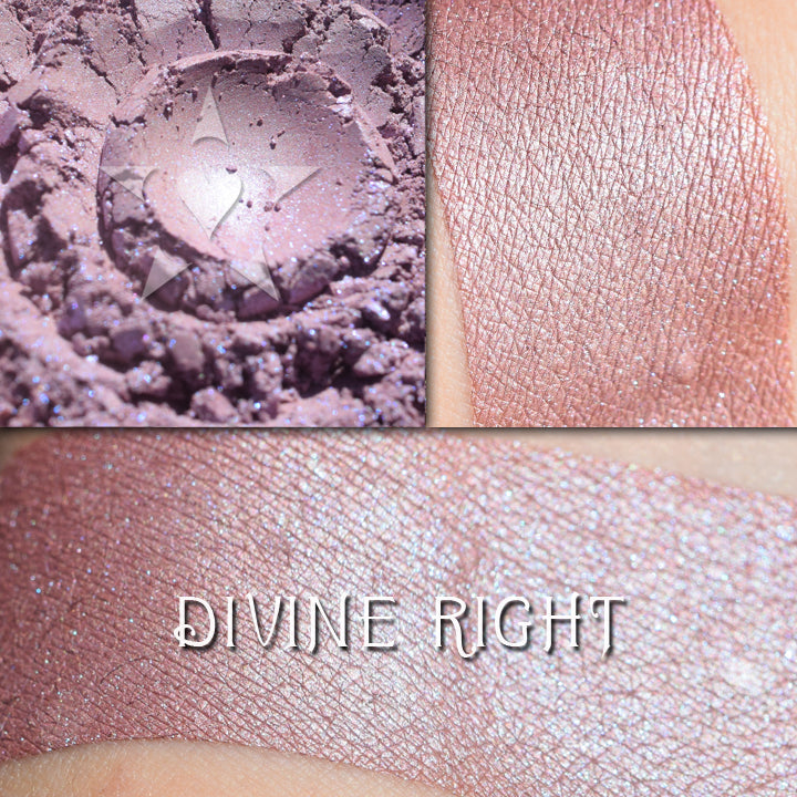 DIVINE RIGHT - Highlighter loose and swatched on the skin. a mauved taupe base with strong blue iridescence.