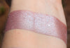 DIVINE RIGHT - Highlighter swatched on medium tone caucasian skin