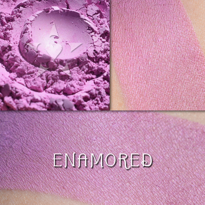 ENAMORED - Rouge loose and swatched on the skin. a vibrant pinkish-lilac rouge with a satin finish.