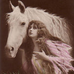 Vintage sepia tone photograph of a woman in ethereal robes next to a white horse.
