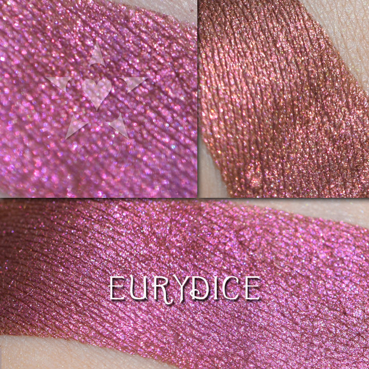EURYDICE - EYESHADOW loose and swatched on the skin. A jewel-toned burgundy that flashes to fuchsia and also copper. 