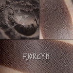 Fjorgyn matte finish eyeshadow shown loose and swatched on the skin. Deep blackened umber.
