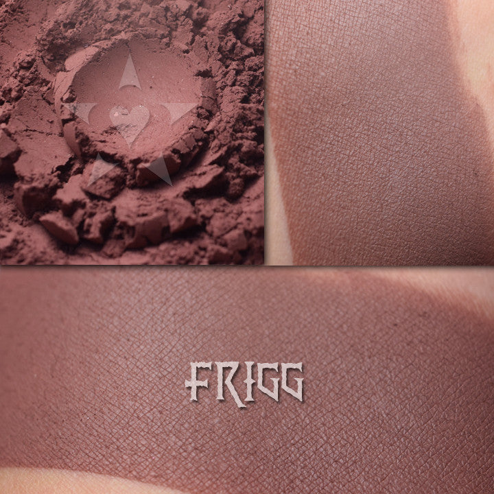Frigg Matte finish eyeshadow shown loose and swatched on the skin. Deep russet/mahogany brown.