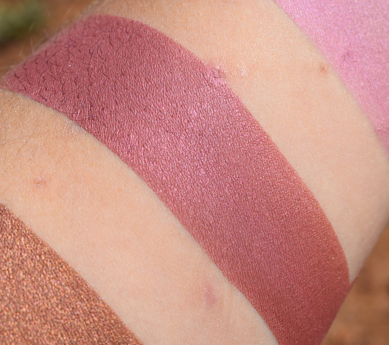 FAREWELL - Rouge swatched on medium tone caucasian skin.