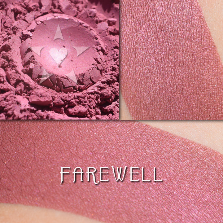 FAREWELL - Rouge loose and swatched on the skin. Farewell a reddish berry rouge with a satin finish.