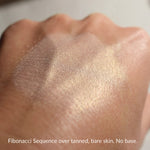 FIBONACCI SEQUENCE over tanned bare skin, no base.