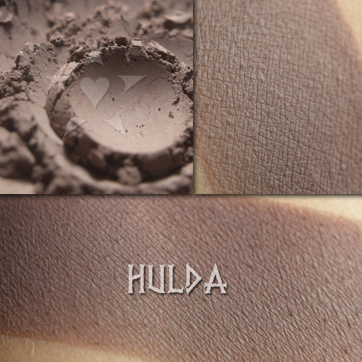 Hulda matte finish eyeshadow shown loose and swatched on the skin.  Cool slate/taupe