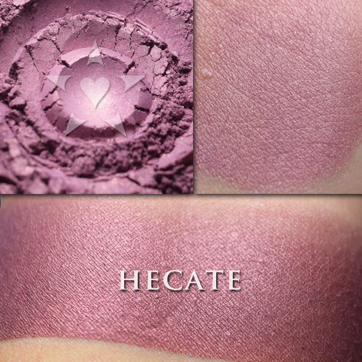 HECATE- Rouge loose and swatched on the skin.  a softly lustrous plum