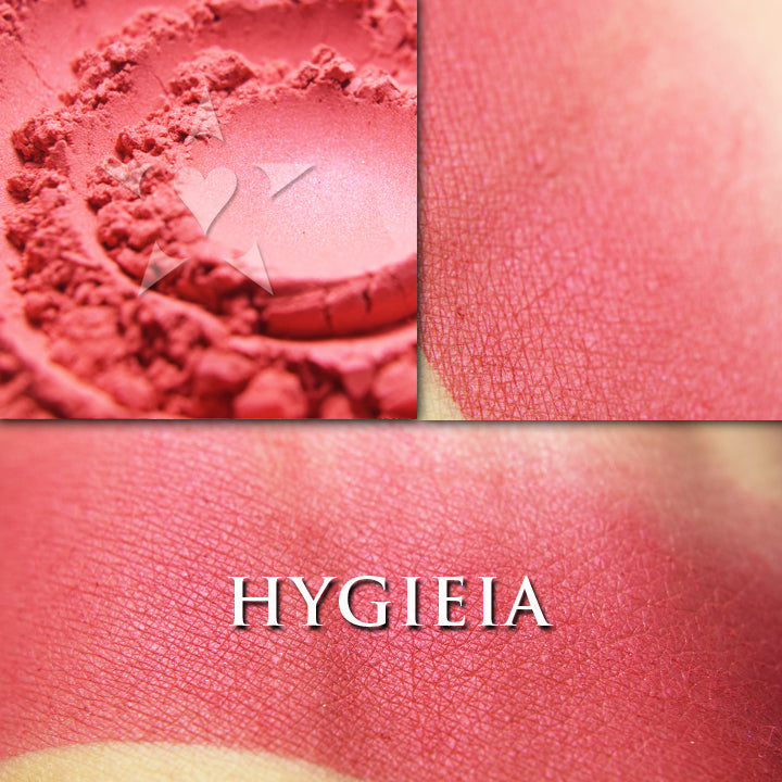 HYGIEIA - Rouge loose and swatched on the skin. This shade is a mostly matte, slightly glowy neutral red. Not too blue, not too orangey, this soft red has the slightest sheen