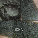Irpa matte eyeshadow shown loose and swatched on the skin. Dark blackened emerald.