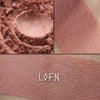 Lofn shown loose and swatched on the skin. Midtone rose petal peach/pink.