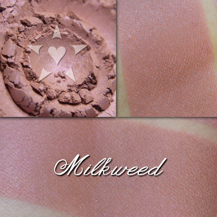 Milkweed blush loose and swatched on the skin. Soft buff/blush pink with subtle iridescence.