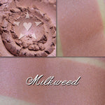 Milkweed blush loose and swatched on the skin. Soft buff/blush pink with subtle iridescence.