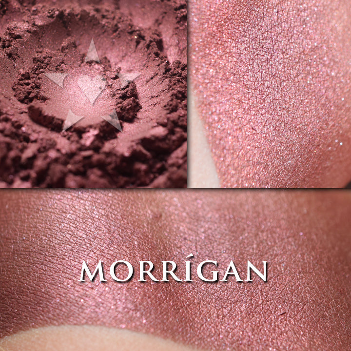 Morrigan loose and swatched on the skin. Soft wine/russet with reddish metallic lustre and a little bit of reddish twinkle, but it's not frosty or sparkly.