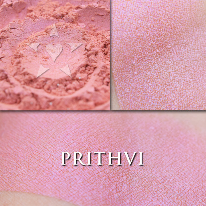 Prithvi rouge loose and swatched on the skin. PRITHVI, a soft and wearable pale coral peach with delicate inner glow.