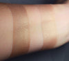 Paonias swatched on medium tone caucasian skin, over primer and bare skin,. A muted warm brown.