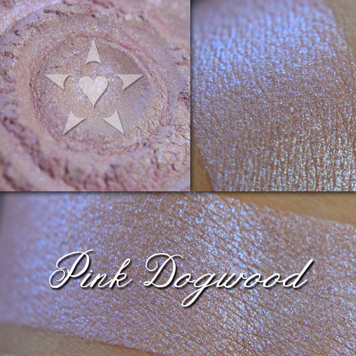 Pink Dogwood eyeshadow loose and swatched on the skin.  A pale pink with strong blue shift.