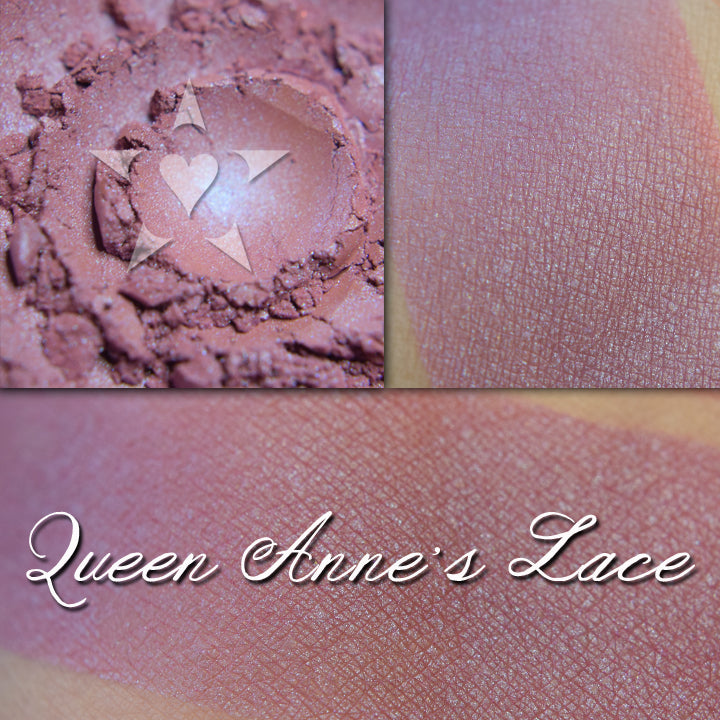 QUEEN ANNE'S LACE - Soft Lustre Blush  loose and swatched on the skin. Soft purplish-pink with subtle iridescence.