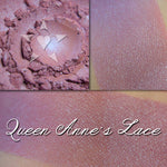 QUEEN ANNE'S LACE - Soft Lustre Blush  loose and swatched on the skin. Soft purplish-pink with subtle iridescence.